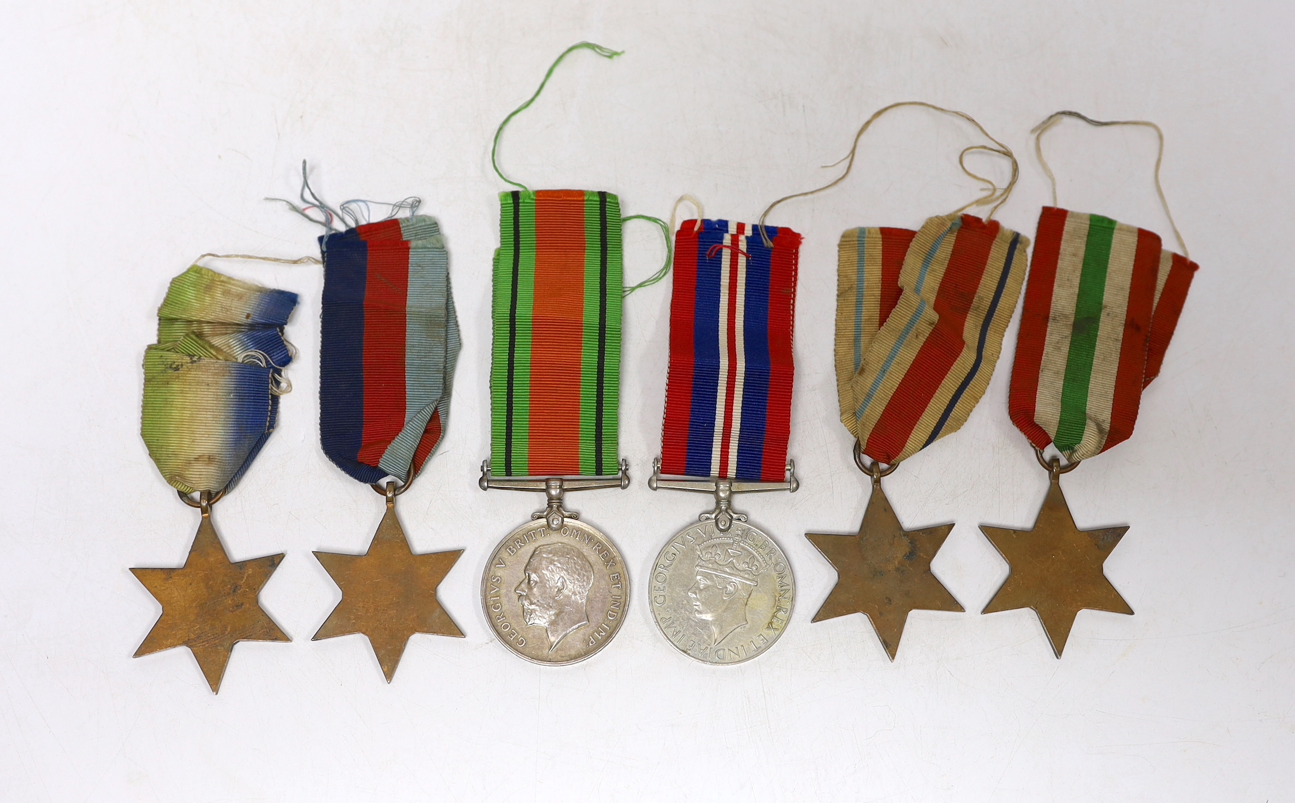 Six WWII medals. The Atlantic Star, The Italy Star, The Africa Star, The 1939-45 Star, The Defence Medal and The War Medal